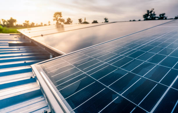 istock Selective focus on solar panel or photovoltaic module with sunset sky. Solar power for green energy. Sustainable resources. Renewable energy. Clean technology. Solar cell panels use sun light. 1359826805