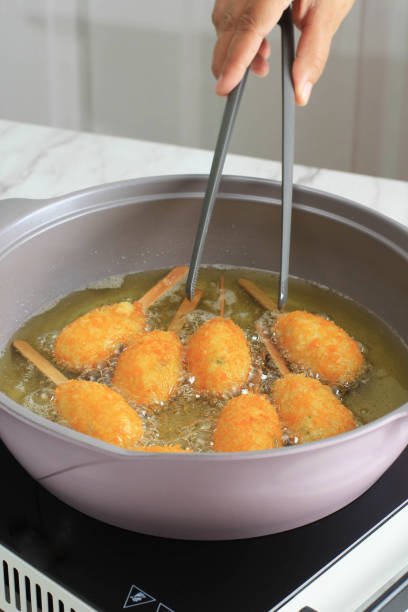 istock Cooking Process : Fried Chicken Sempol with Hot Oil 1359828038