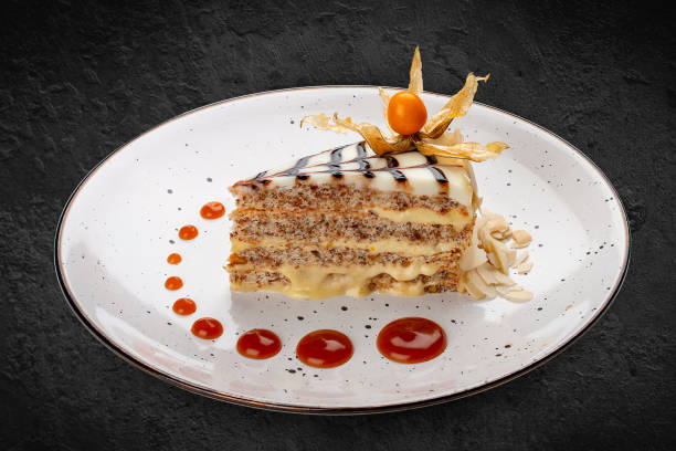 istock Traditional Hungarian Esterhazy cake. Isolated on a black background. 1359829134