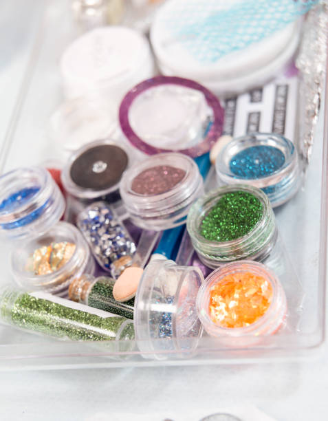 istock Bright glitter for nail manicure. decoration for nails from multicolored sequin closeup. manicure brocade 1359831181