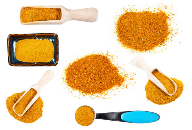 set of ground Imeretian Saffron cutout on white set of ground Imeretian Saffron (Dried Marigold Flowers) cutout on white background substitute for saffron stock pictures, royalty-free photos & images