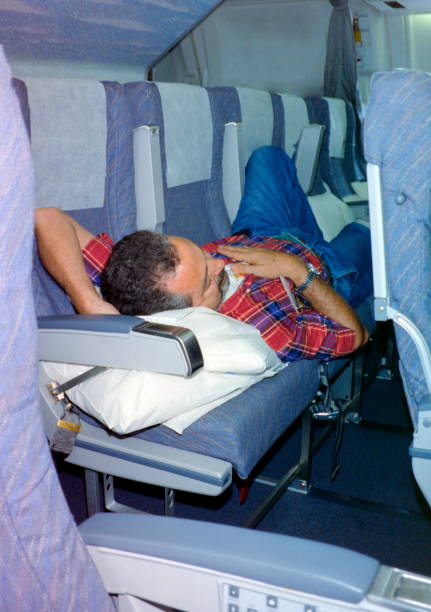 istock The nineties. Tired tourist during the flight over Java on holiday to Bali, Indonesia 1991. 1359831412