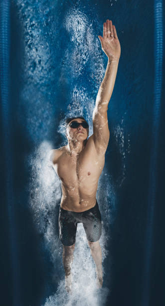 Professional male swimmer. View underwater