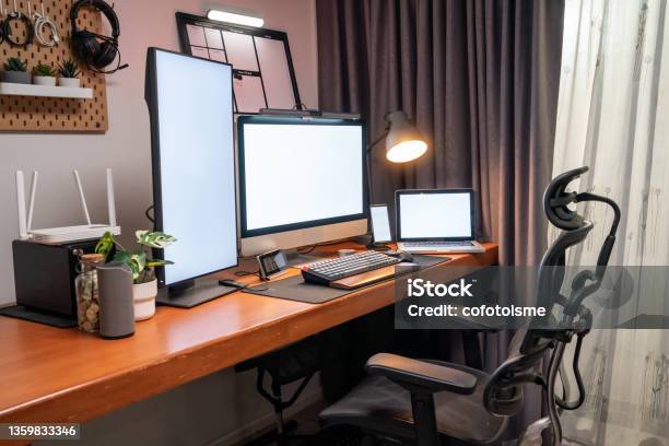 Home Office For Work Of Place Computer Device With White Screen On Desk In Apartments Working At Home Concept Stock Photo - Download Image Now