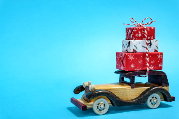 istock Christmas gifts on toy car 1359833558