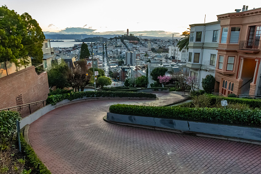 The crookedest street in the world Lombard street at  dawn. San Francisco is in early morning light.