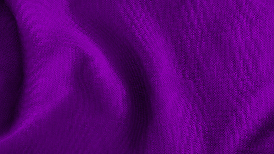 close up creased purple or violet shiny silk fabric texture use as background with space for design. abstract smooth elegant pink fabric texture. soft satin silk background with flowing waves.