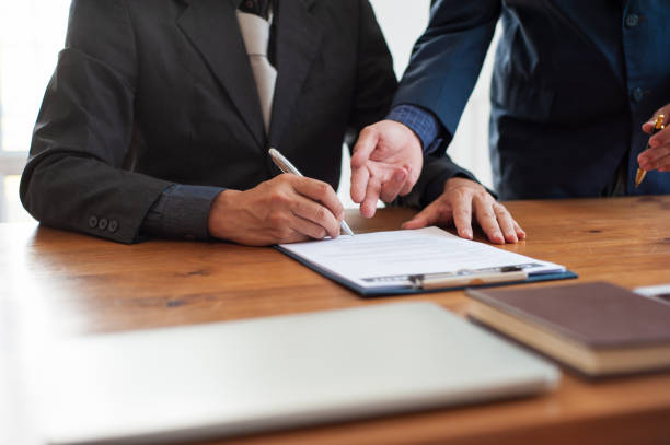 istock Business people signing a contract agreement. 1359839051