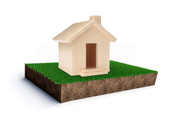 istock Wooden Mini House on Grass patch soil earth cut piece 3d illustration 1359839749