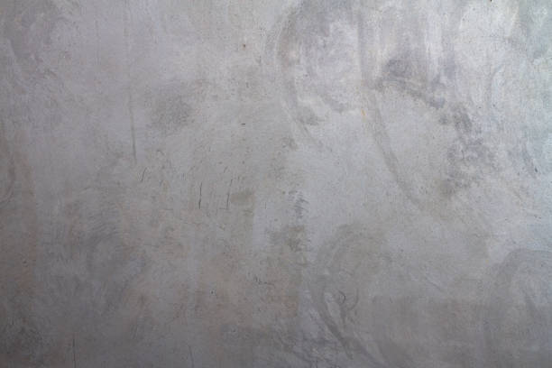 Grey plastered wall covered with rough textured plaster. Background. copy space stock photo