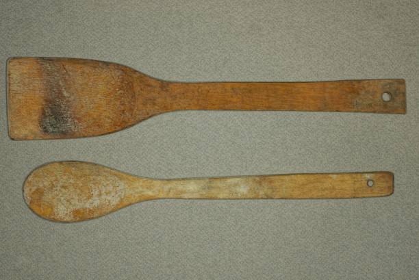 istock brown dirty wooden spoon and kitchen spatula 1359842730