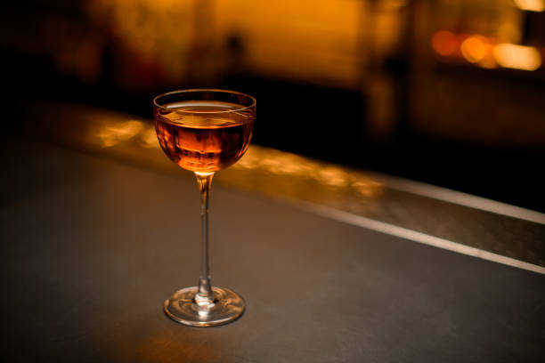 istock angle view of beautiful wine glass with drink on the table 1359843020