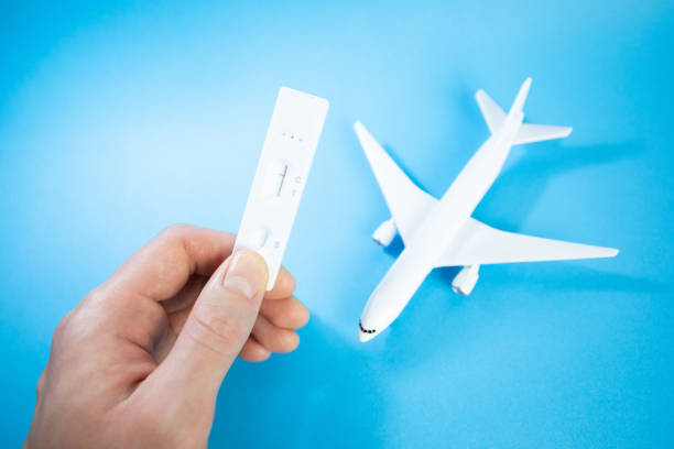 istock Coronavirus (COVID-19) rapid lateral flow test in hand. Rapid antigen test. COVID-19 Self-Test. Negative test result. Covid restrictions on travel to slow the spread of the new Omicron variant. 1359843916