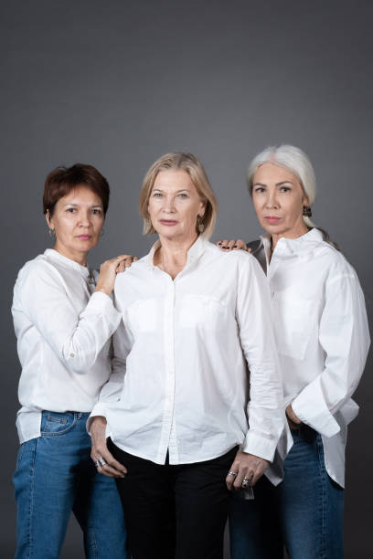 istock Elegant mature women posing at camera 1359844213
