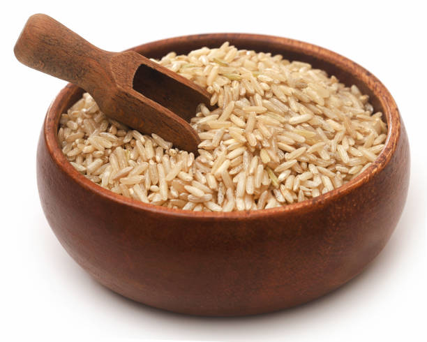 uncooked riso integrale - brown rice rice healthy eating organic foto e immagini stock