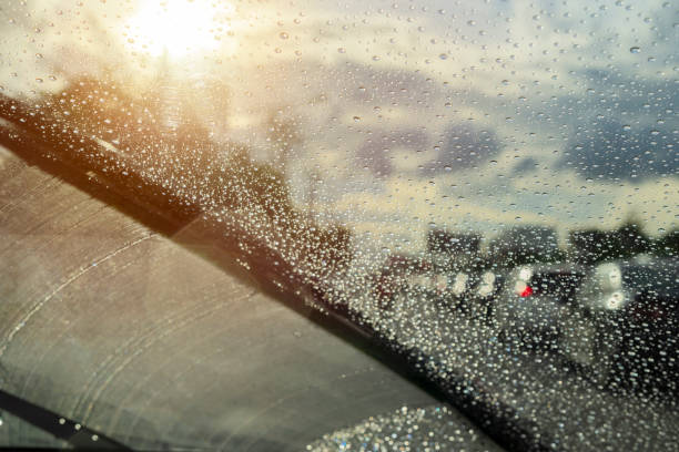 istock Raindrops closely from the windshield, dark clouds, evening heavy rain 1359849353