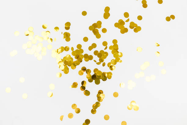 istock golden confetti on white background flat lay text place - Image 1359856362