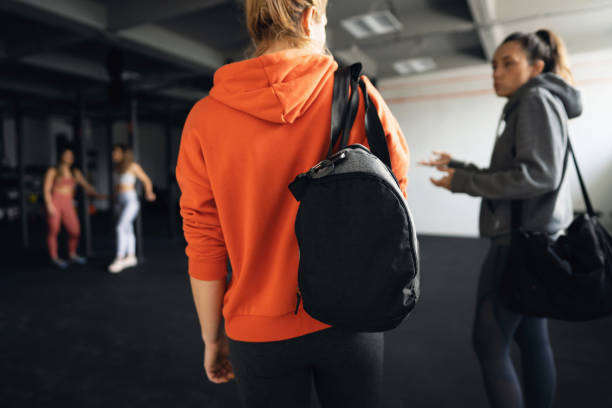 istock Active Caucasian female athletes, talking while arriving in the gym 1359860046