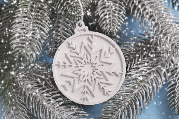 Snowflake Gypsum, Plaque Plaster or Concrete Mold. Enhanced durability to frost when hardened. Concrete, Gypsum Christmas ball on blue textured gypsum. Building Material Used in Construction.