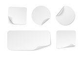 Set of adhesive stickers with curved corner. Realistic white paper round, rectangular and square stickers. Blank mockup sticky label. Empty promotional tags. Vector illustration.