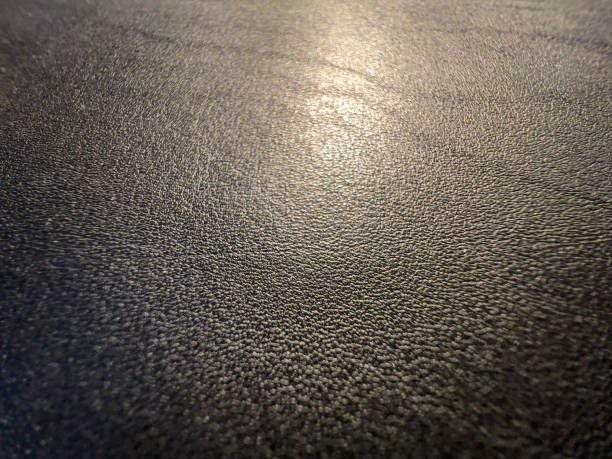 istock A macro image of fine black leather in the light. 1359861923