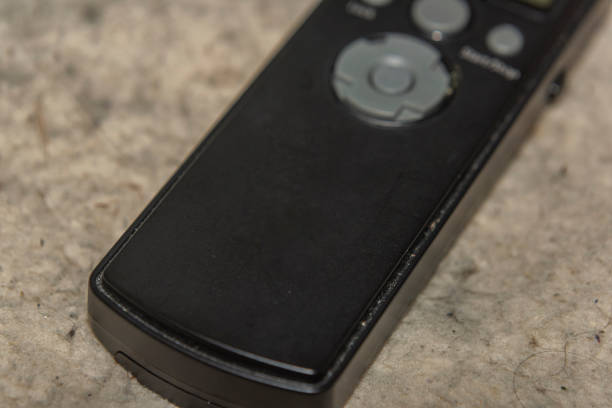 istock Black accesories for flash with transmitter and receiver on dirty background 1359863835