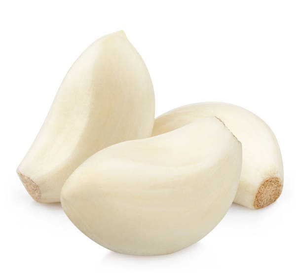 istock Peeled garlic cloves on white 1359867325