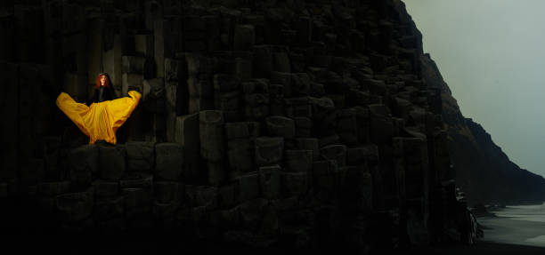 istock Women posing and feeling beautiful at famous basalt columns in Iceland. 1359867493