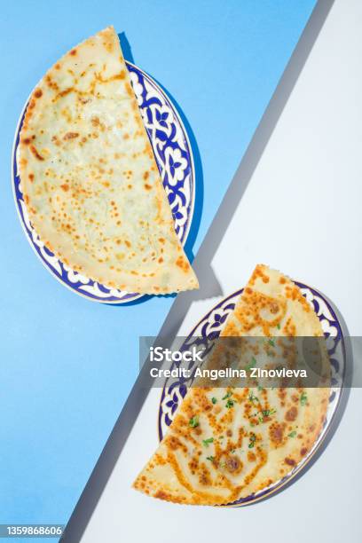 Traditional Azerbaijan Cuisine Flat Bread With Herbs Kutaby Qutabi Kutabi On Blue Stock Photo - Download Image Now