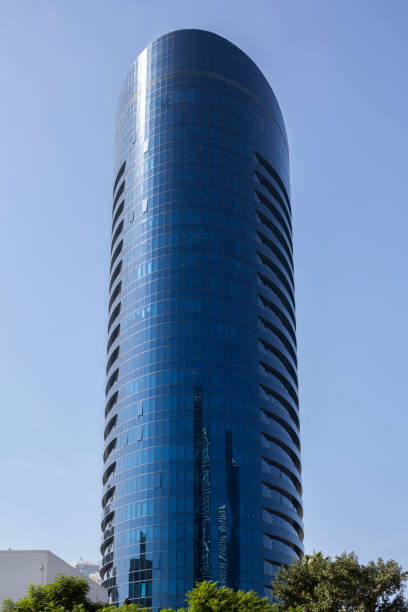istock Modern glass skyscraper against blue sky 1359868614