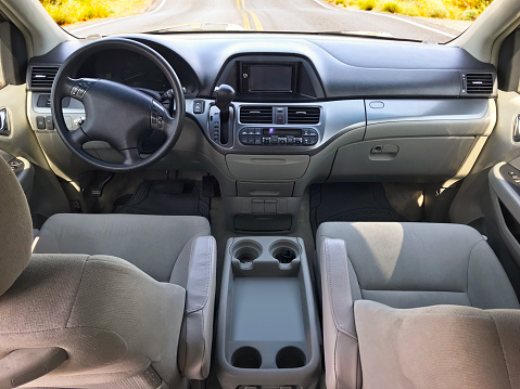 Dashboard and wide angle interior shot of a car