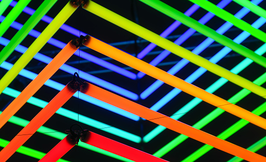 Neon lights as a background. Installation of neon lines for the design. An art installation of colored lights. Photo in high resolution.