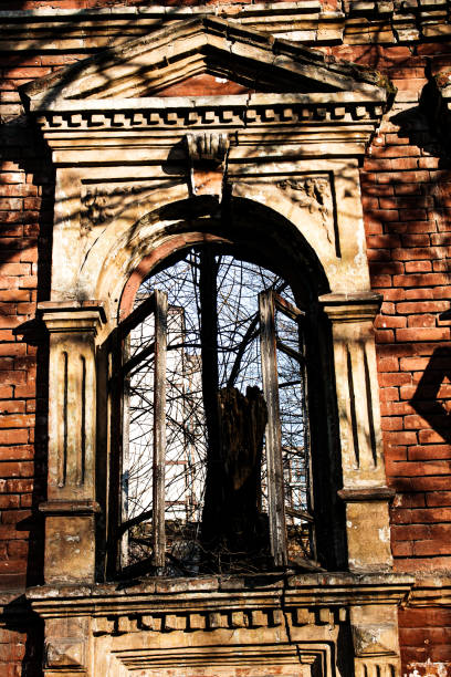 Ruined view of an old nineteenth century house in the city of Dnepropetrovsk, Ukraine. View of window openings without frames Ruined view of an old nineteenth century house in the city of Dnepropetrovsk, Ukraine. View of window openings without frames. n11 stock pictures, royalty-free photos & images