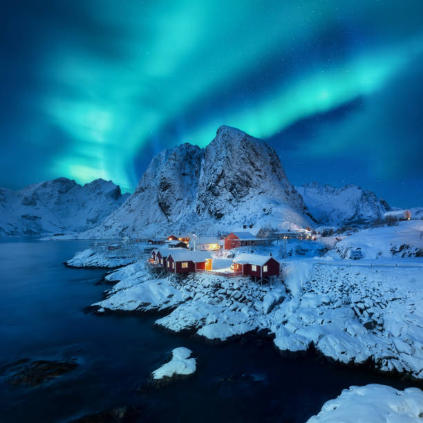 Aurora Borealis, Lofoten islands, Norway. View on the houses in the Hamnoy village, Lofoten Islands, Norway. Iconic view in Norway. High resolution photo. Aurora Borealis, Lofoten islands, Norway. View on the houses in the Hamnoy village, Lofoten Islands, Norway. Iconic view in Norway. High resolution photo. norway aurora borealis aurora polaris fjord stock pictures, royalty-free photos & images