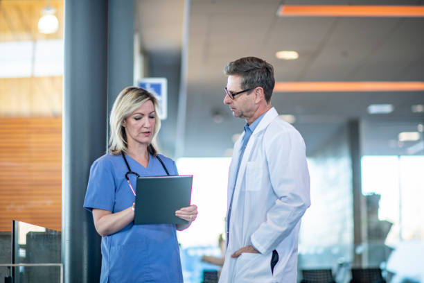 istock Medical Colleagues Discussing a Case 1359874645