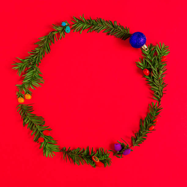istock Christmas wreath, on a red background, 2022 1359875300