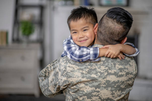 istock Little Boy Hugging His Military Father 1359876372