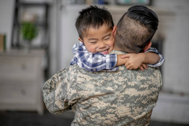 istock Little Boy Hugging His Military Father 1359876374