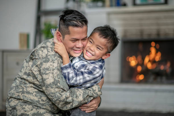istock Little Boy Hugging His Military Father 1359876383