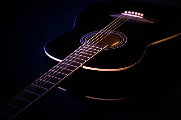 istock black guitar split colored concept. guitar music dark shoot 1359878886
