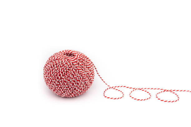 istock A ball of red and white cord. Decorating thread. 1359879635