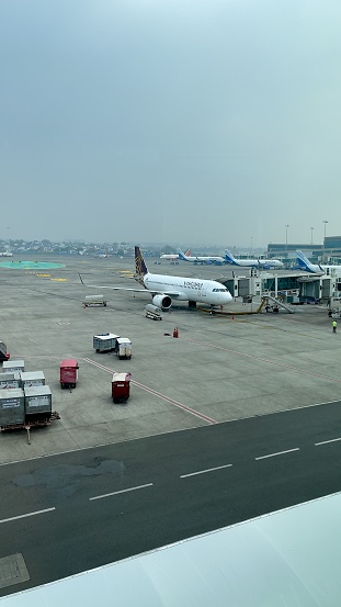 Mumbai, India- Dec 3,2021-Planes waiting for passengers to board the flight to their next destination