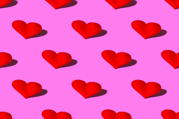 istock Red heart with a hard shadow on a pink background. Seamless patterns. Celebrating Valentine's Day copy space. 1359882188