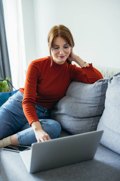 istock Home Office: Young Woman Using a Laptop 1359884356
