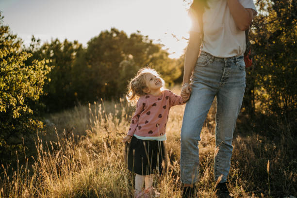 istock Young mother spending time with her little daughter in nature 1359885449