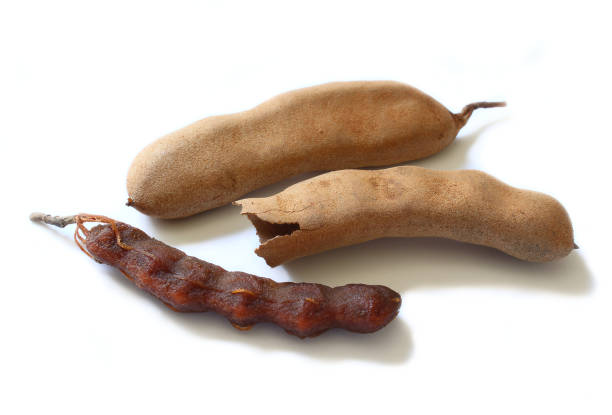 istock Tamarind exotic fruit isolated on white background. 1359889357