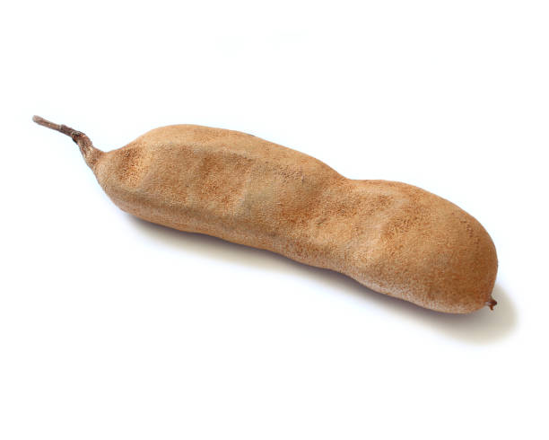 istock Tamarind exotic fruit isolated on white background. 1359889393