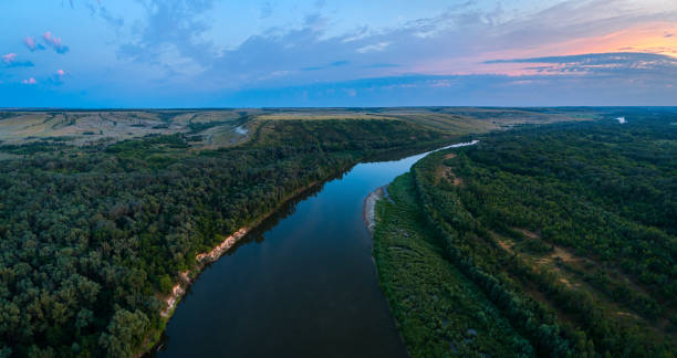 istock Aerial panoramic landscape with sunset over the river and beautiful clouds on the sky. 1359891776