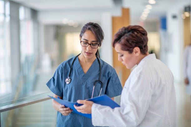 istock Female Doctors Discussing a Patient Treatment Plan 1359895972