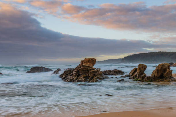 istock Rocks and waves - sunrise seascape at Bermagui 1359897486